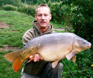 paul baker with a 20lb mirror caught from grove lake mid september