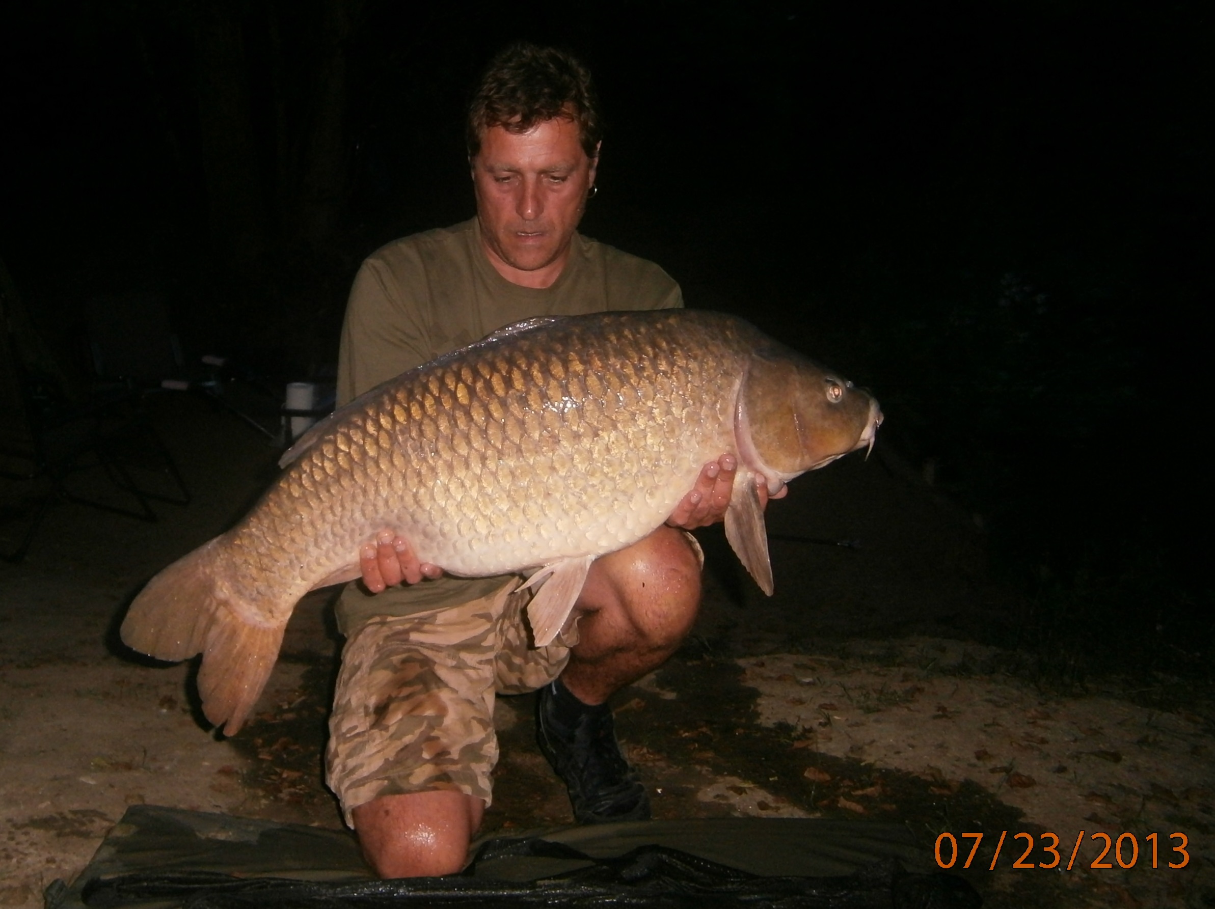 John O'Brien with a 32lb common from Heron lake. 'Carpark swim' does it again!