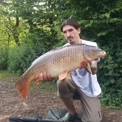 Jack the hat with a 20lb 4 oz common carp from Heron lake