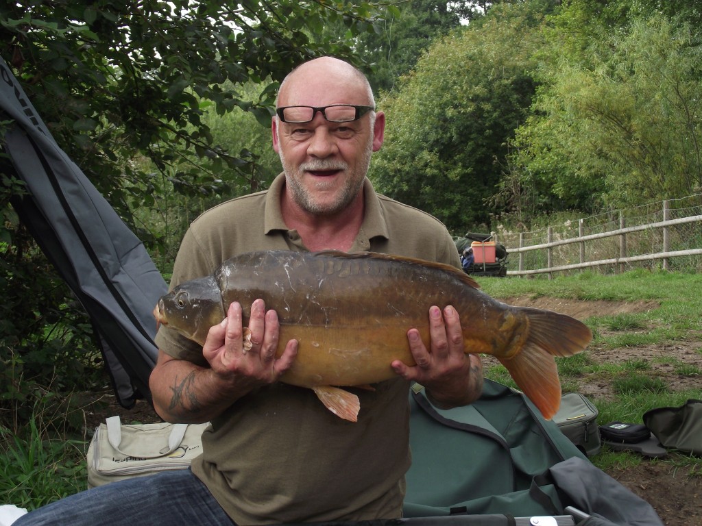 Mr Woodcock with a 20lb mirror from Grove lake