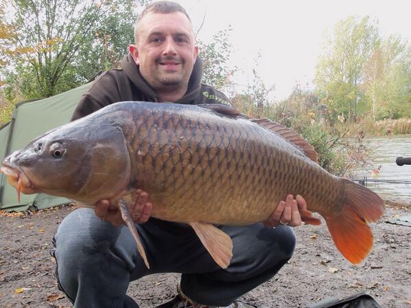 Craig Soames with his pb common from Heron 28lb 8 oz