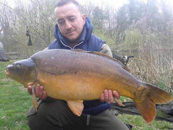 Carl McKail with a 20lb 4 oz mirror from Grove lake