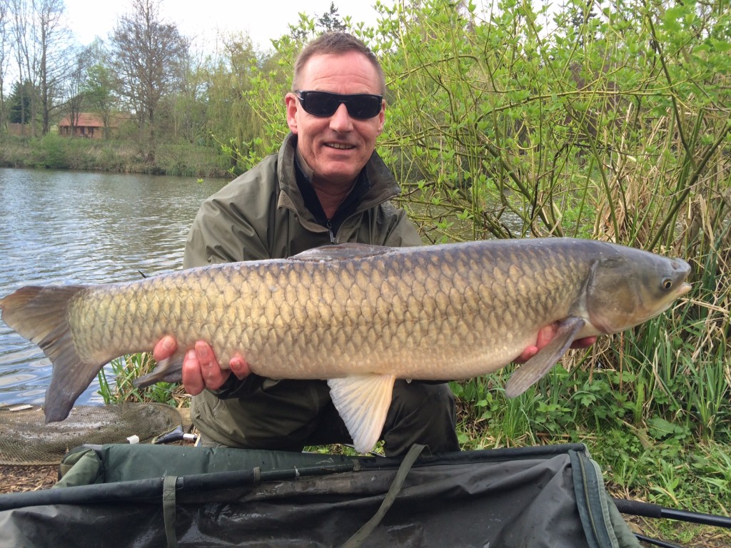 Paul Baker with a 20lb grass carp from Heron