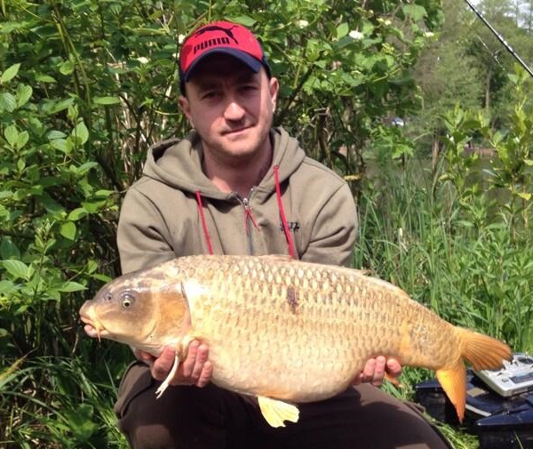 Carl Mckail with a 20ln 6oz ghost carp from heron