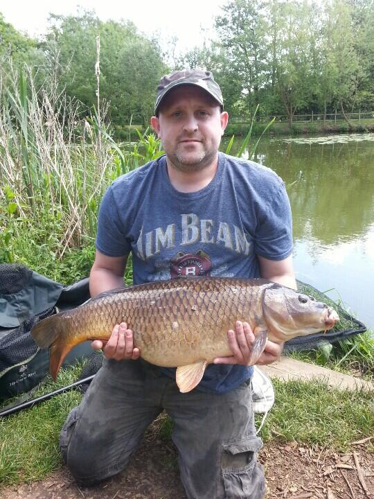 Kevin Shaw with a 21lb 12oz common from Grove lake