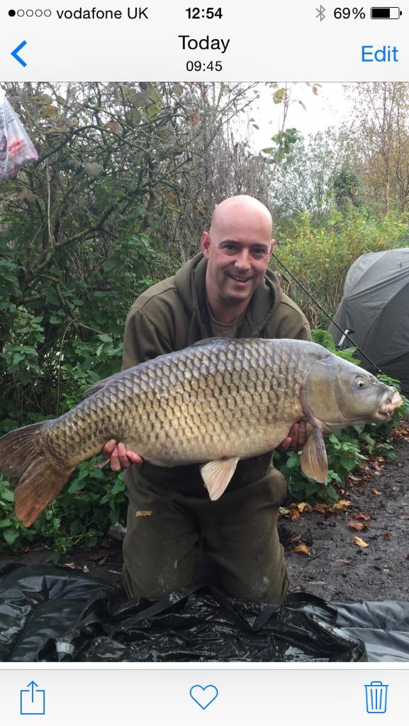 Michael Dixon with a lovely 34lb common from Heron lake