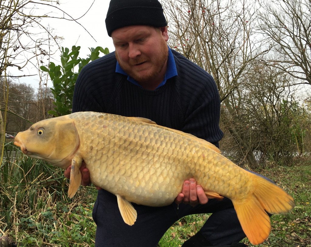 Graham Clarke with a lovely bright 23lb 2oz Ghost carp from Heron lake